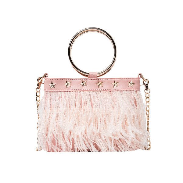 Moodne tuttide ja metallelementidega naistekott