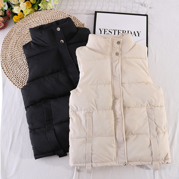 Kõrge krae ja taskutega sügisene naistevest