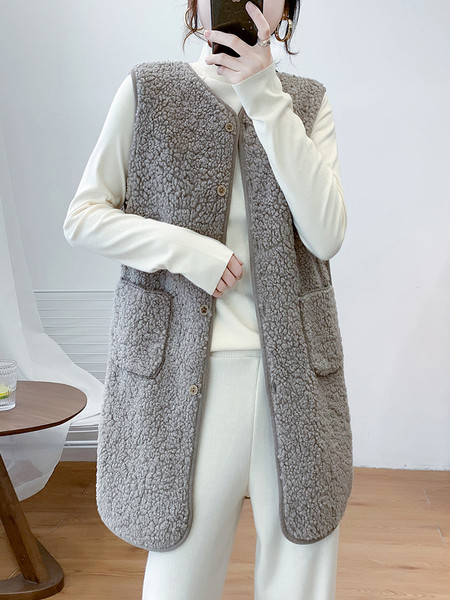 Naiste pikk nööpide ja taskutega sulevest