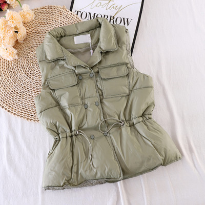 Naiste vest taskute ja elastse vöökohaga