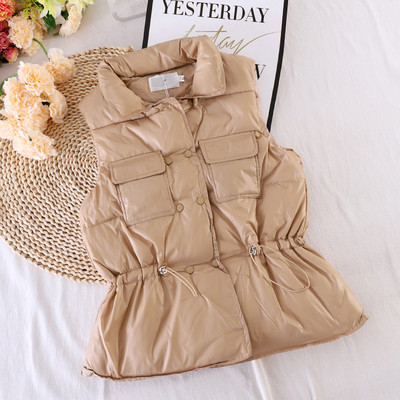 Naiste vest taskute ja elastse vöökohaga