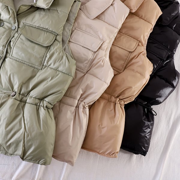 Naiste vest taskute ja elastse vöökohaga