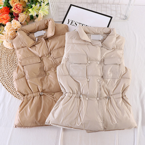 Naiste vest taskute ja elastse vöökohaga