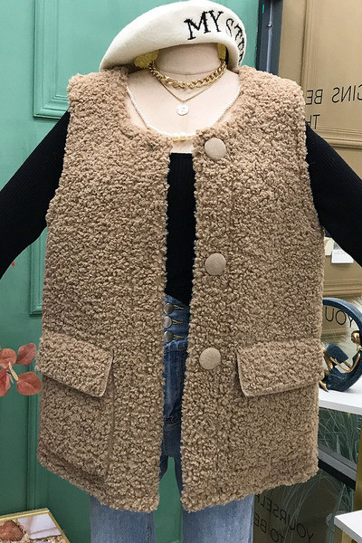 Praegune naiste vest ovaalse krae ja nööpidega