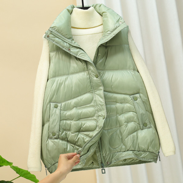 Laia mudeliga naiste vest kõrge krae ja taskutega