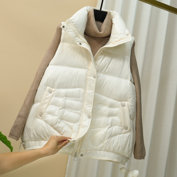 Laia mudeliga naiste vest kõrge krae ja taskutega