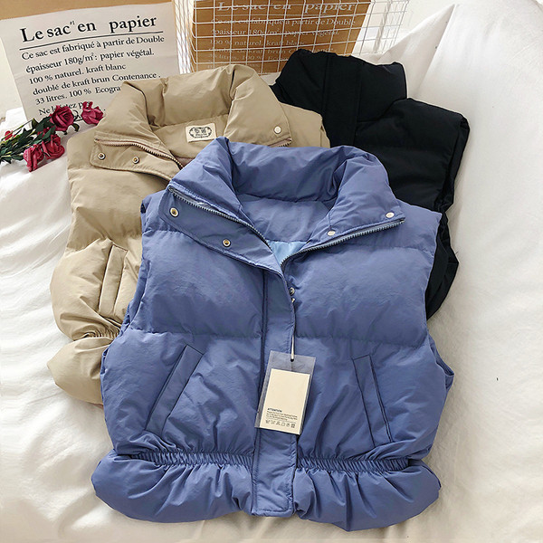 Naiste lühike kõrge krae ja taskutega vest