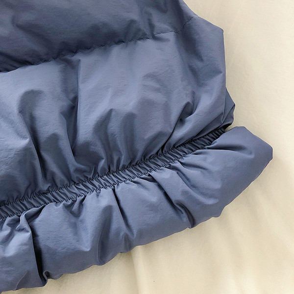 Naiste lühike kõrge krae ja taskutega vest