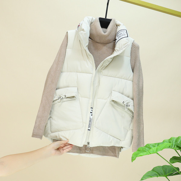 Naiste fliisvest taskute ja kõrge kraega