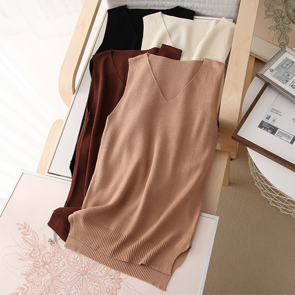 Pikk vabaaja kootud vest spitsikaelusega