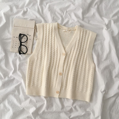 Kootud naiste vest V-kujulise krae ja nööpidega