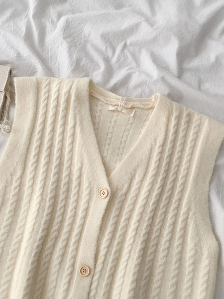 Kootud naiste vest V-kujulise krae ja nööpidega
