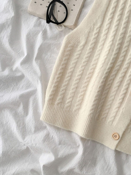 Kootud naiste vest V-kujulise krae ja nööpidega