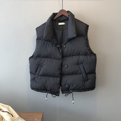 Naiste vest nööpide ja taskutega