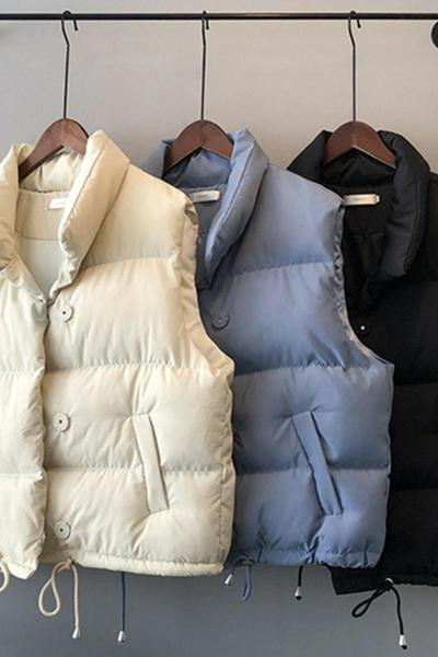 Naiste vest nööpide ja taskutega