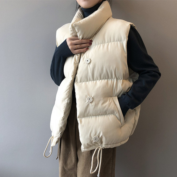 Naiste vest nööpide ja taskutega