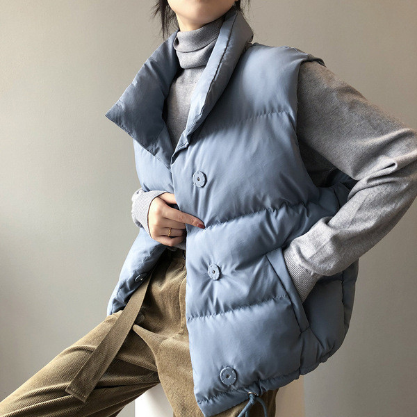 Naiste vest nööpide ja taskutega