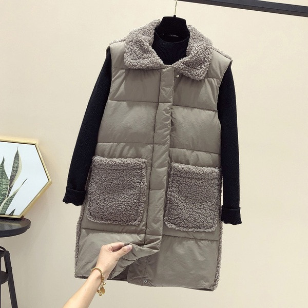 Naiste pikk taskute ja ududega vest