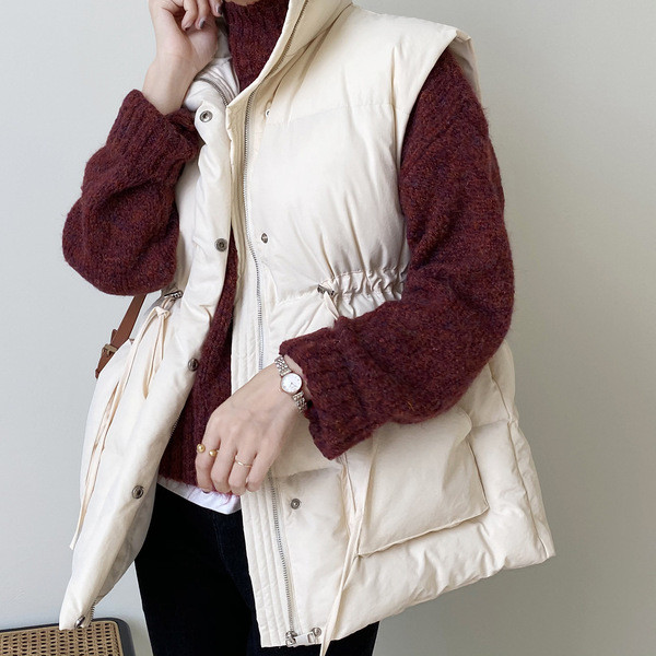 Moteriška liemenė elastingu juosmeniu ir didelėmis kišenėmis