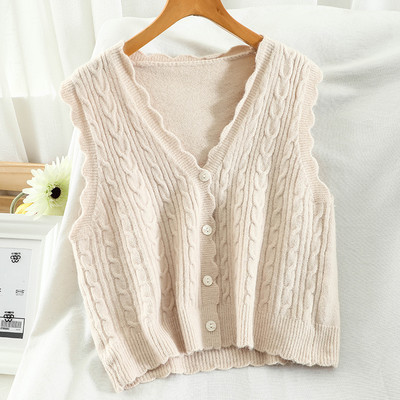 Kootud naiste vesti spits kaelus ja nööbid