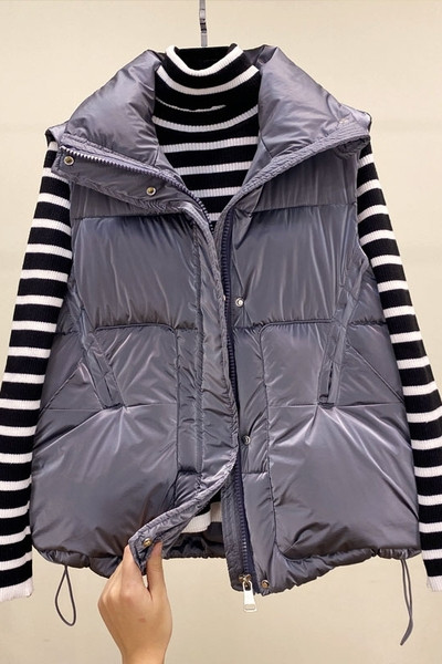 Ženski zimski prsluk s patentnim zatvaračem i džepovima