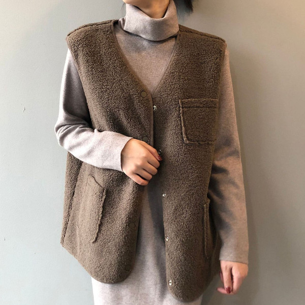 Naiste sügisene sulevest taskutega