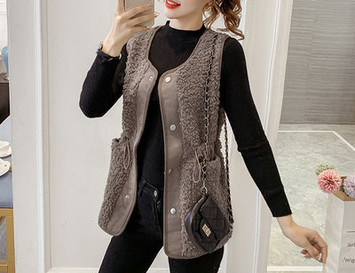 Ženski prsluk s elastičnim strukom i gumbima