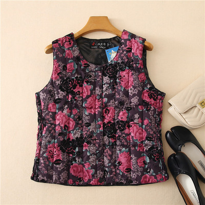 Ümara kaelusega ja lillemotiividega naiste vest