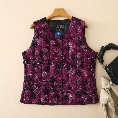 Ümara kaelusega ja lillemotiividega naiste vest