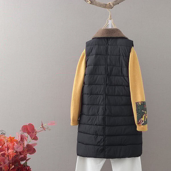 Naiste pikk vest klassikalise krae ja lukuga