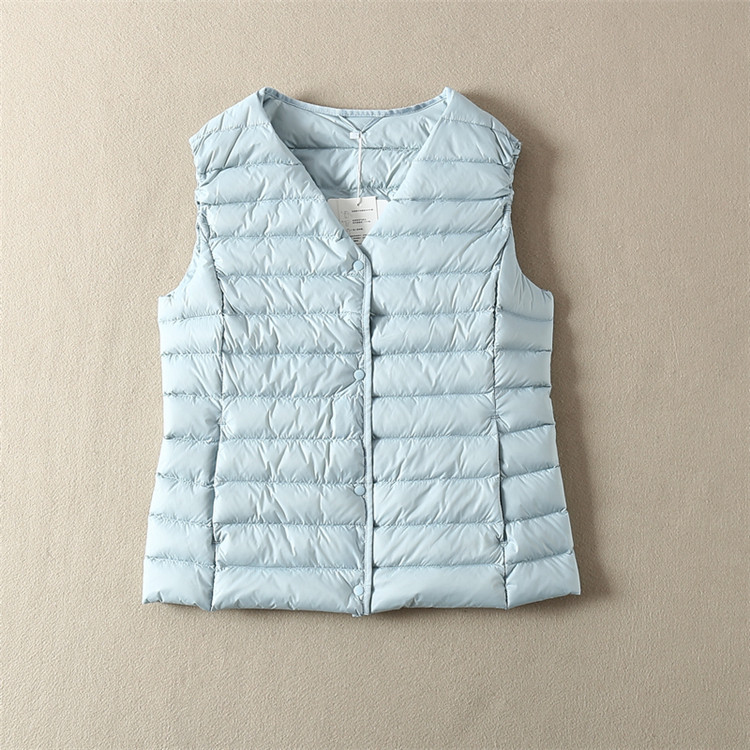 Vabaaja naiste vest ovaalse dekoltee ja taskutega