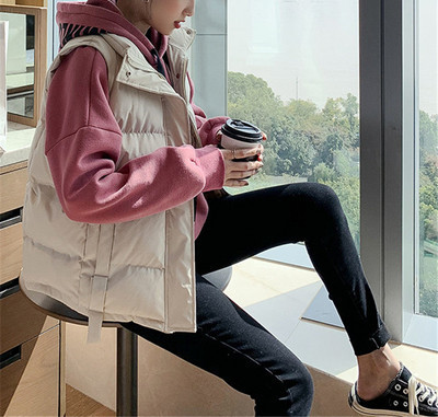 Ženski zimski prsluk s visokim ovratnikom i džepovima