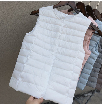 Laisva moteriška kelių spalvų liemenė su špico iškirpte