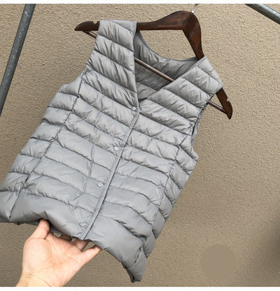 Laisva moteriška kelių spalvų liemenė su špico iškirpte