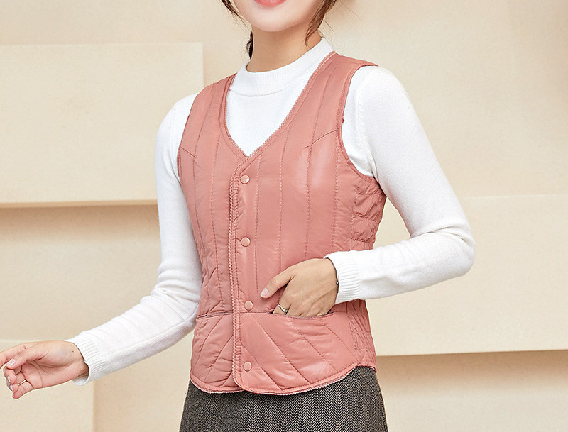 Naiste liibuv vest nööpide ja spitsikaelusega