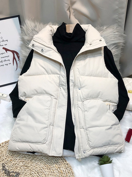 Nööpide ja kõrge kraega naiste vest