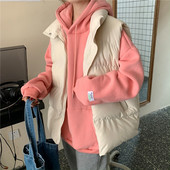 Kõrge krae ja taskutega sügis-talvine naistevest