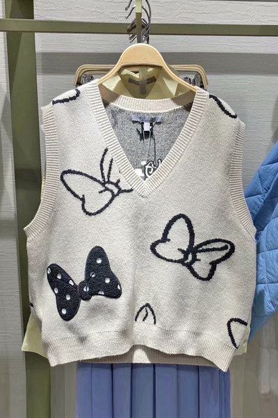 Naiste kootud vest spits-kaelusega beežis toonis