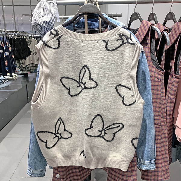 Naiste kootud vest spits-kaelusega beežis toonis