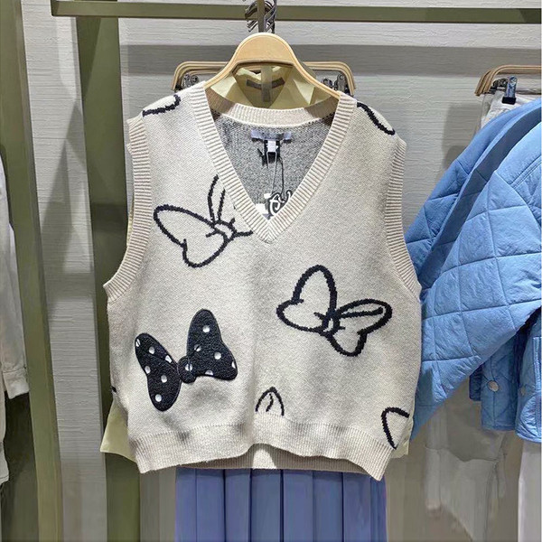 Naiste kootud vest spits-kaelusega beežis toonis