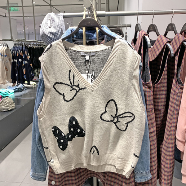 Naiste kootud vest spits-kaelusega beežis toonis