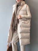 Pikk naiste vest nööpide ja kõrge kraega