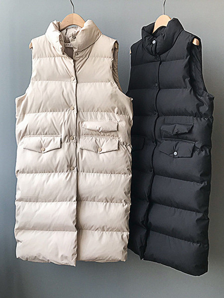 Pikk naiste vest nööpide ja kõrge kraega