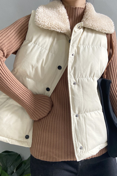 Sügis-talvine vest nööpide ja sulekraega