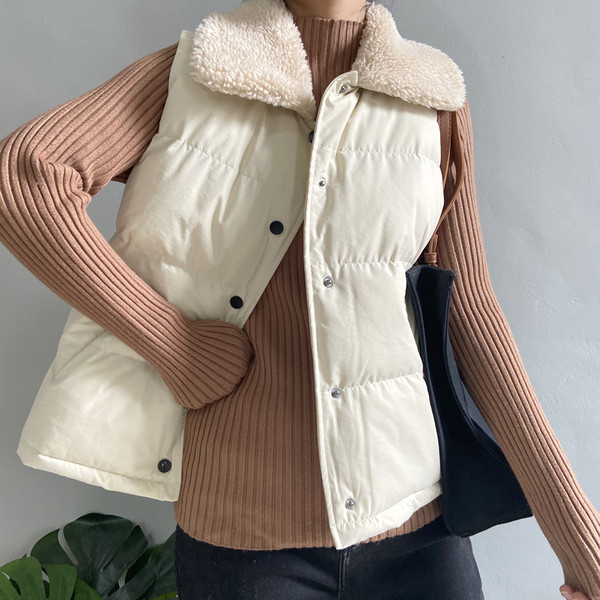 Sügis-talvine vest nööpide ja sulekraega