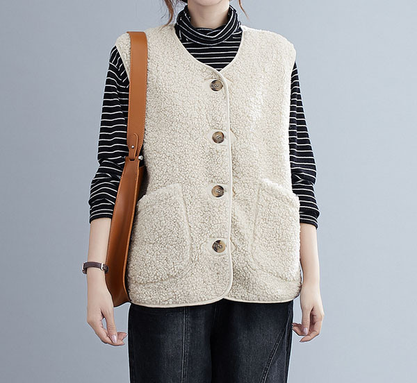 Naiste valge sulevest nööpide ja spitsikaelusega