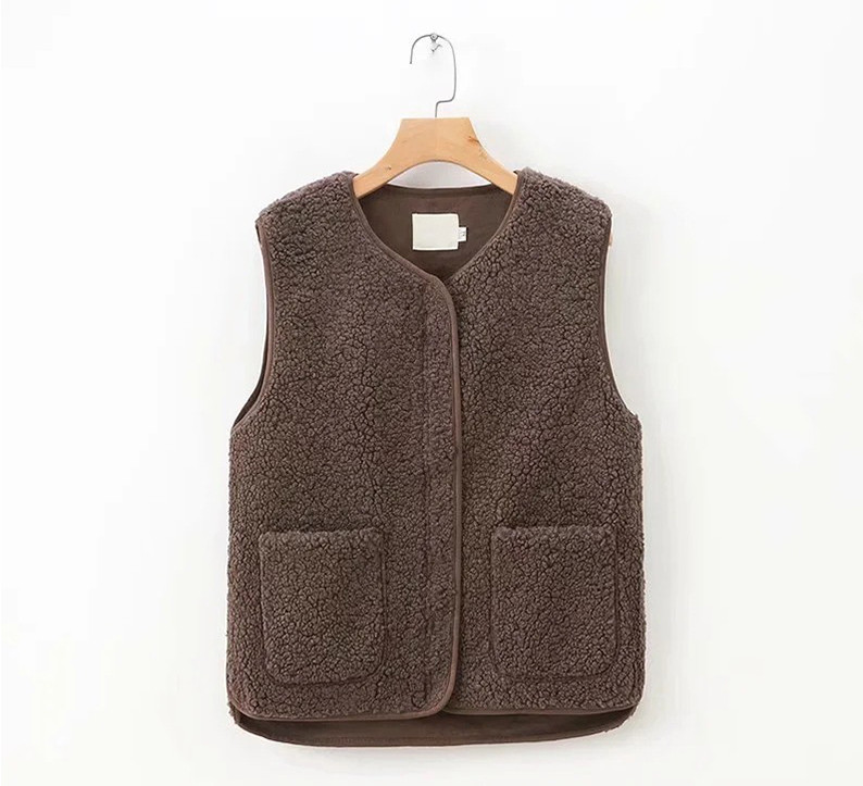 Naiste tasku ja ümara kaelusega sulevest