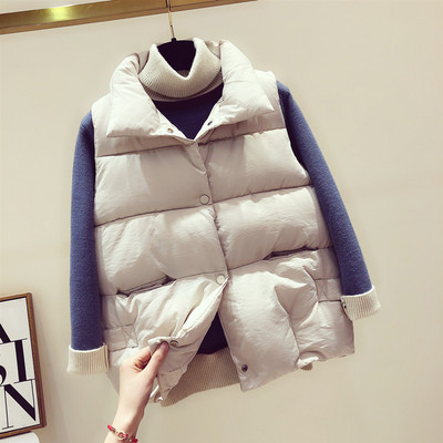 Naiste moodne nööpide ja kõrge kraega vest