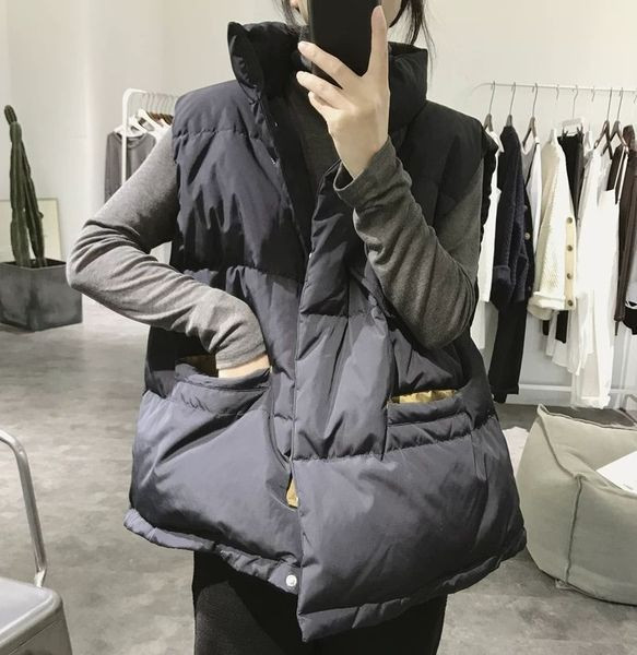 Naiste vesti lai kõrge krae ja taskutega mudel