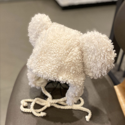 Bolyhos női téli fülvédő nyakkendővel